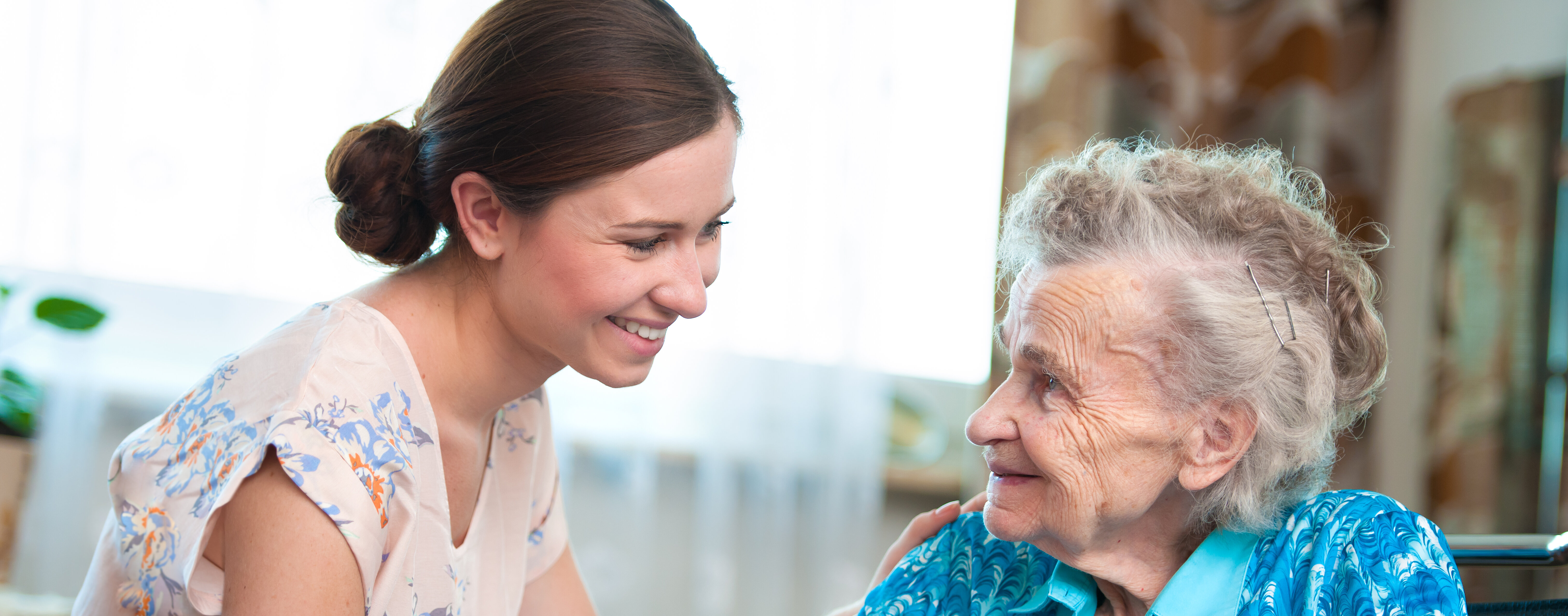 senior woman with home caregiver