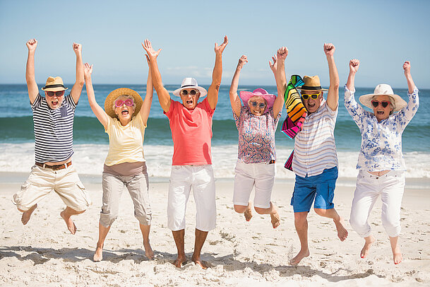 Portrait of senior friends at the beach