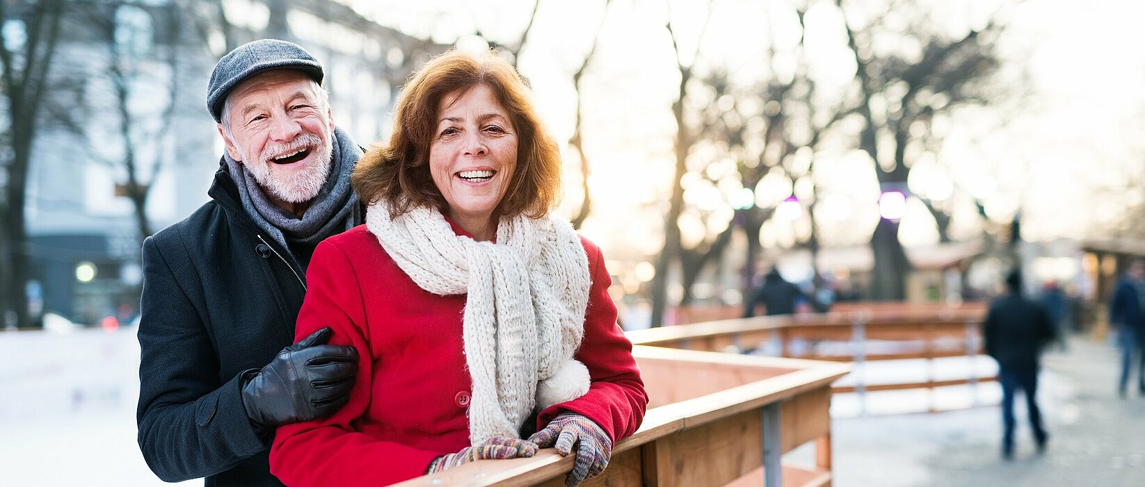 Senior couple on a walk in a city in winter.