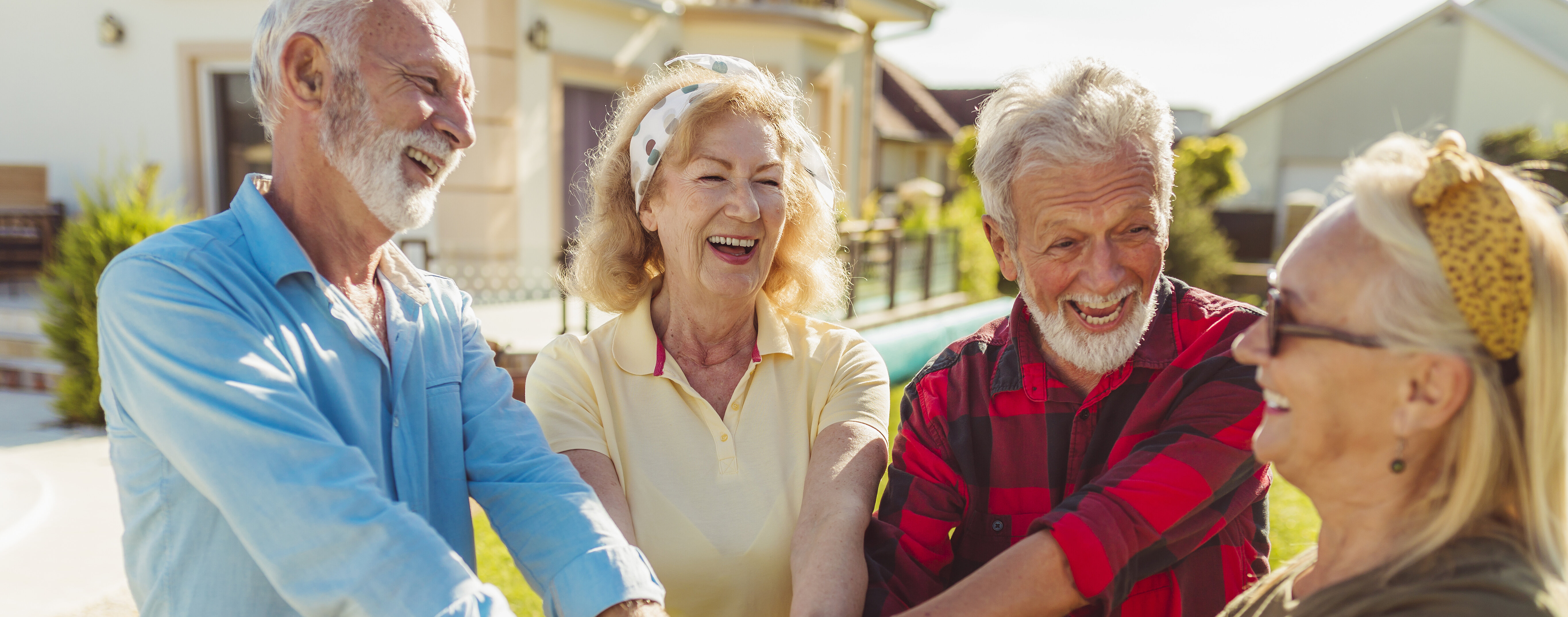 Senior people holding hands in the middle before a football match
